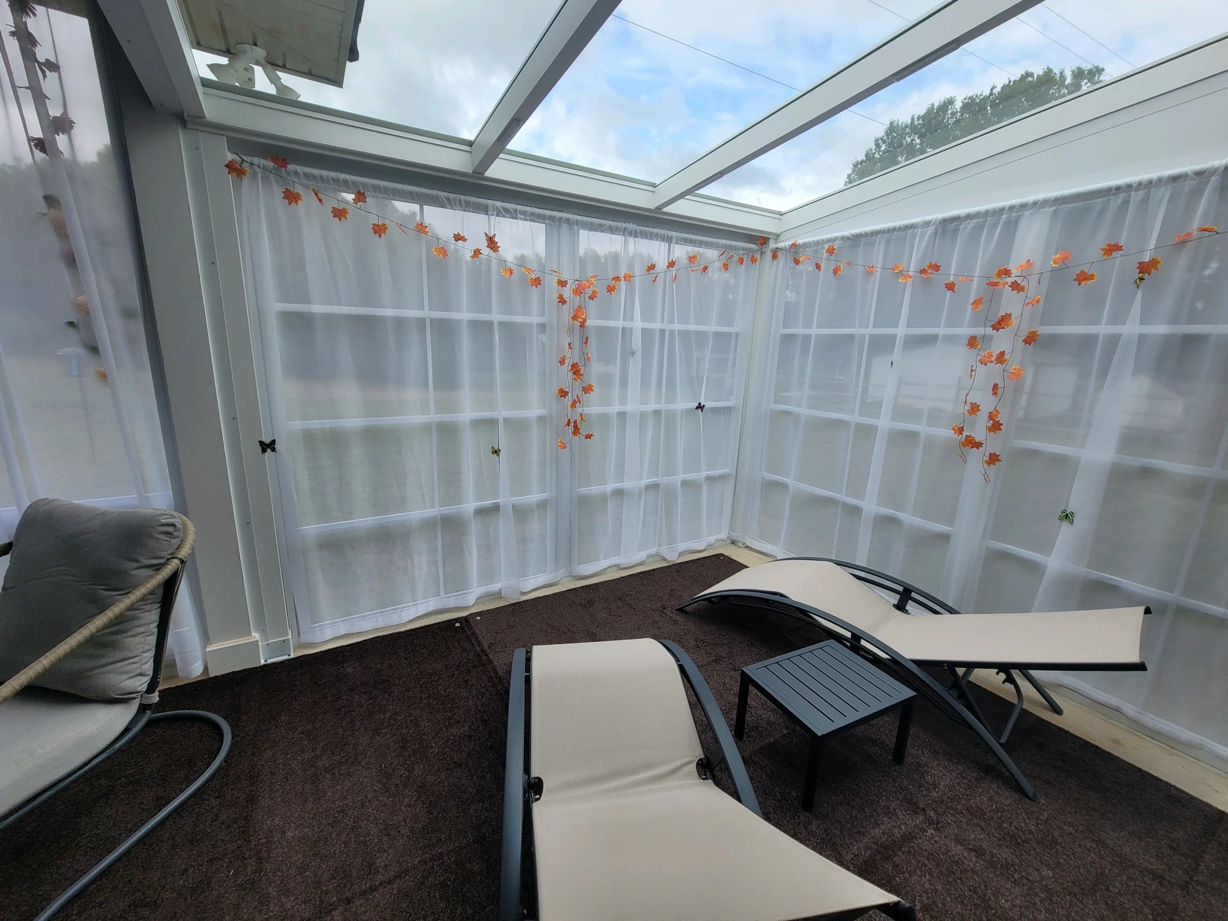 glass roof sunroom interior seating area