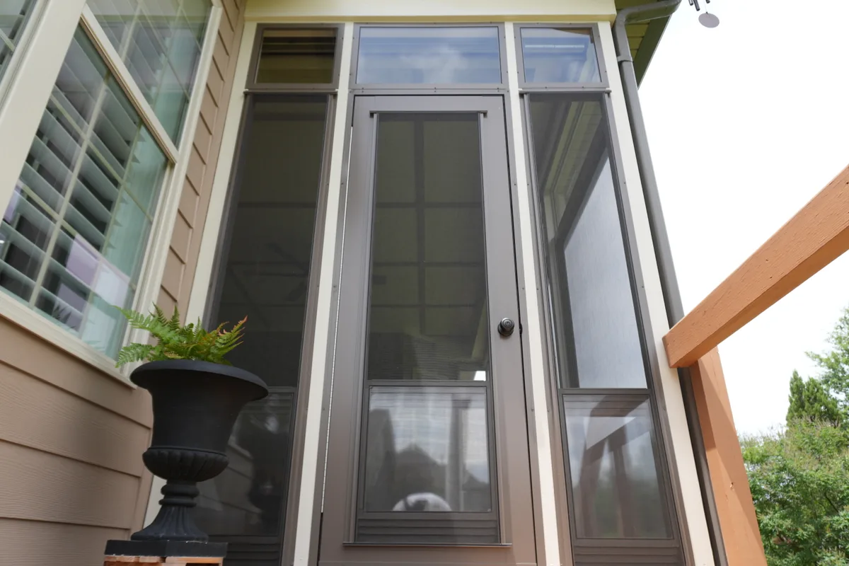Vinyl-film 3-season porch enclosure detail Creekside Charlotte contractor