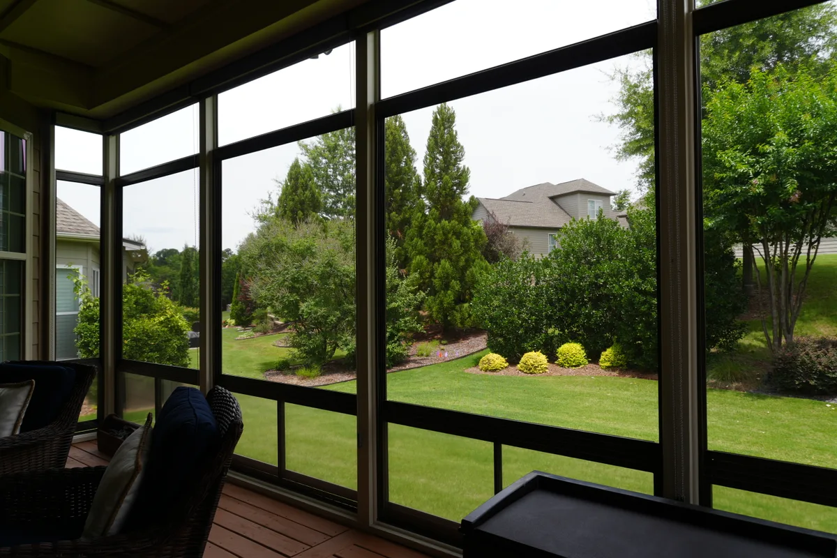 Finished porch enclosure detail vinyl-film sunroom Mecklenburg County NC