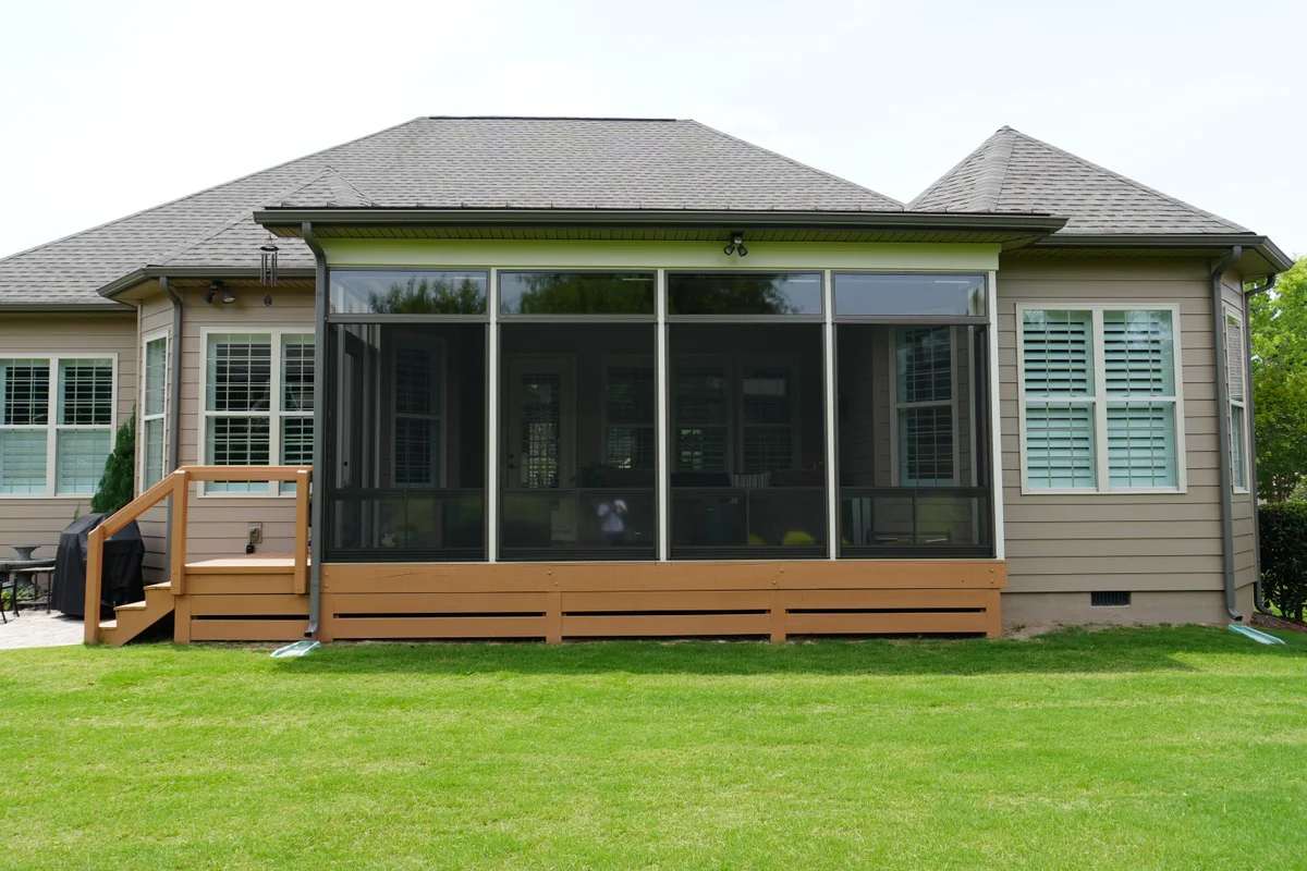 Finished 3-season vinyl-film sunroom addition exterior Creekside Charlotte NC