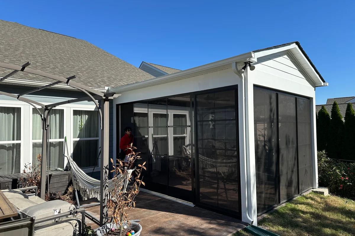 Finished 3-season vinyl porch enclosure exterior view Huntersville NC The Ramble