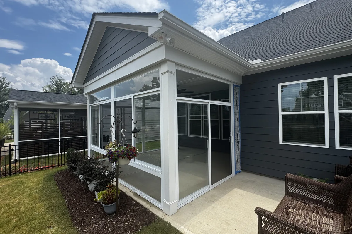 White mullion and frame hardware detail on the Mantle Ridge glass enclosure installation in Indian Trail Union County NC