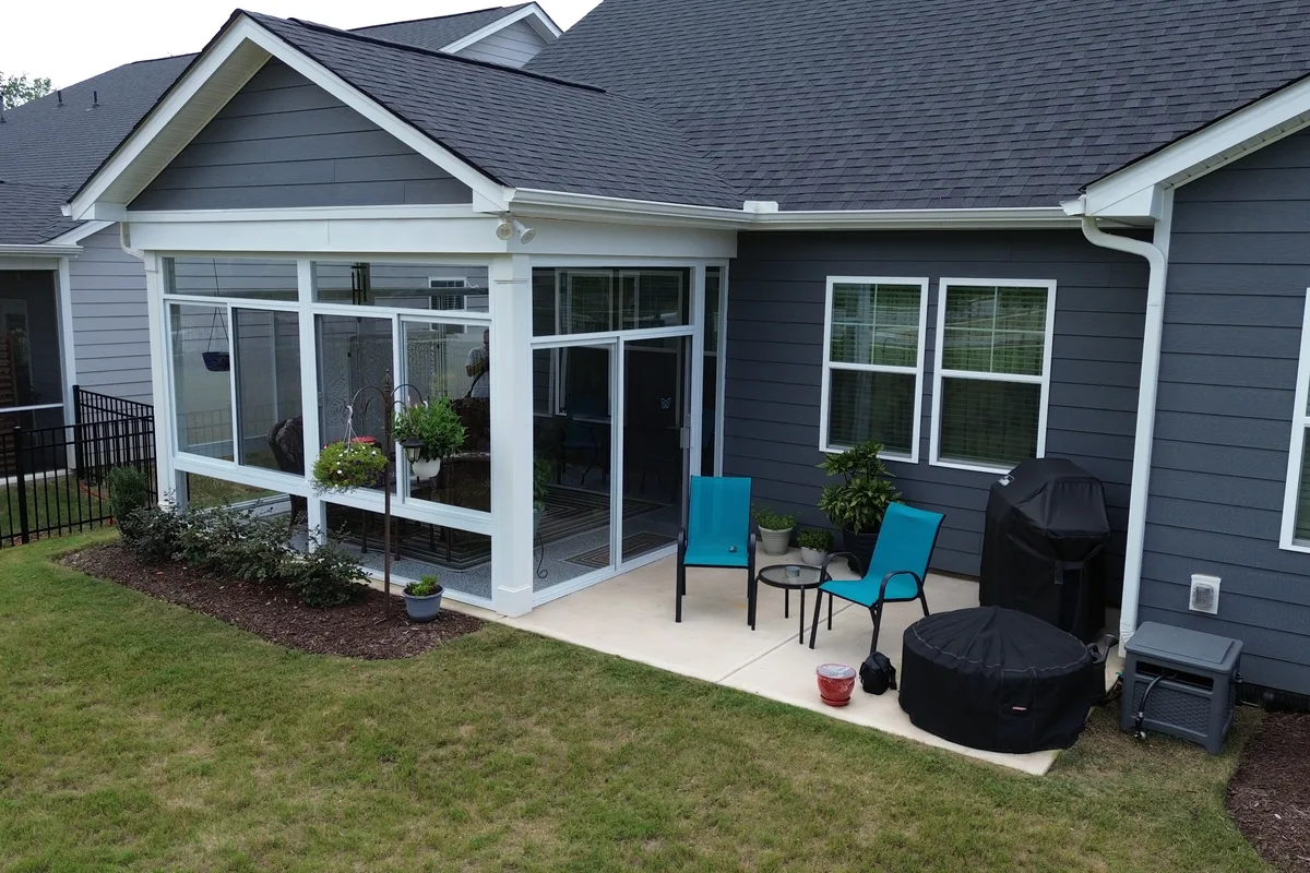 Custom glass transom panels installed above the sliding windows on the Mantle Ridge 3-season enclosure in Union County NC