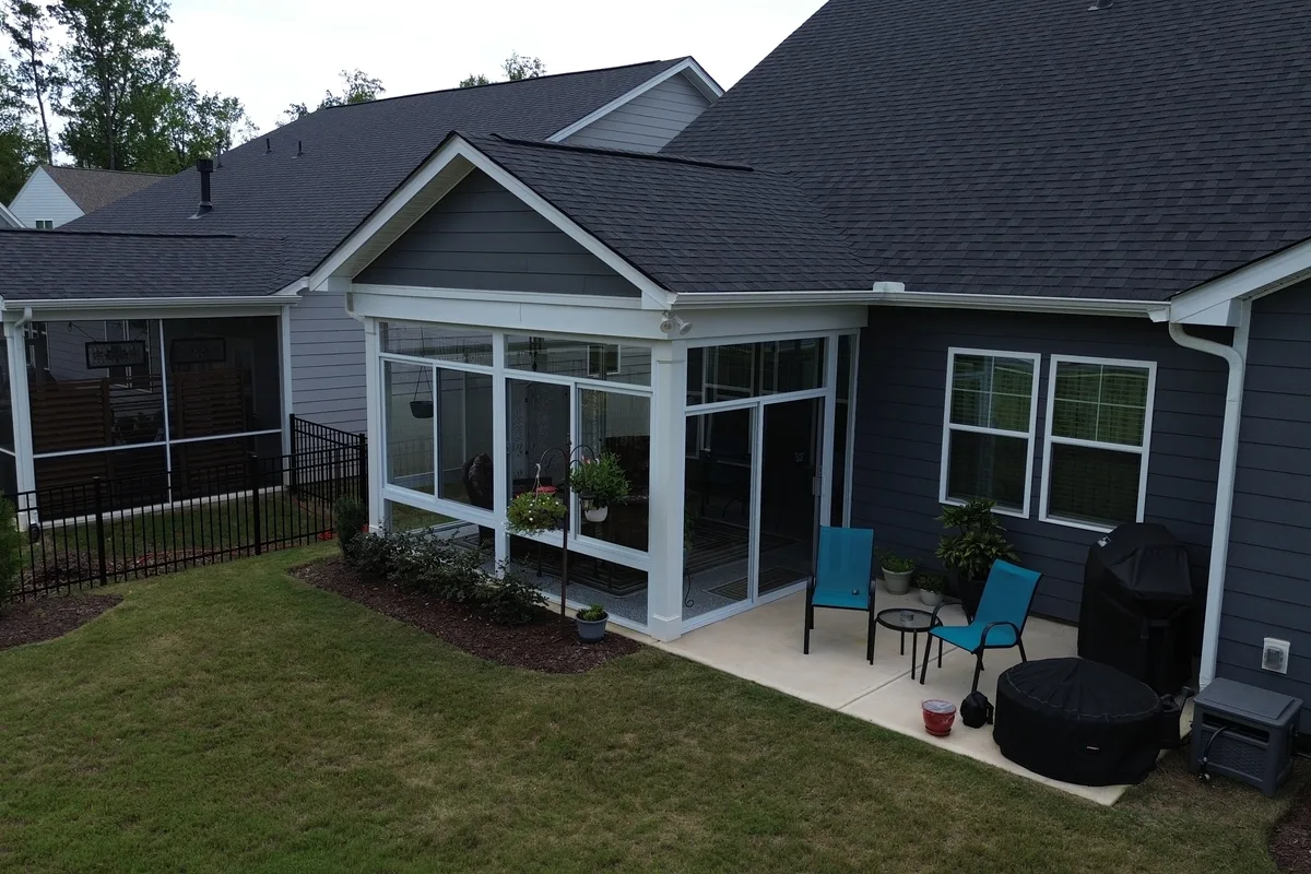 Sliding glass entry door installed on the Mantle Ridge porch enclosure in Indian Trail NC providing access to the protected outdoor room