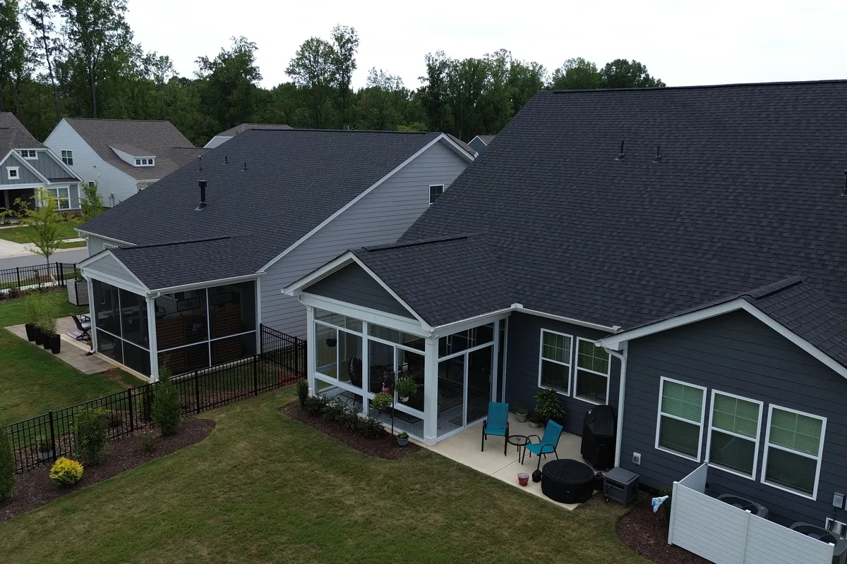 Interior view of the finished 3-season glass enclosure on a Mantle Ridge home in Indian Trail showing the bright open feel of the space