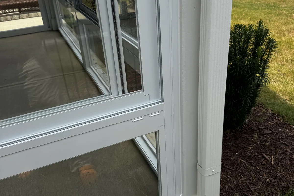Side light panel installed alongside the sliding door on the Mantle Ridge 3-season enclosure adding brightness to the enclosed porch