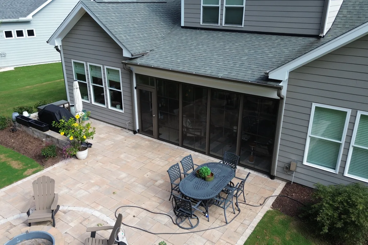 Clear vinyl-film glazing detail on CraftBilt 4-track window system in Gaston County NC
