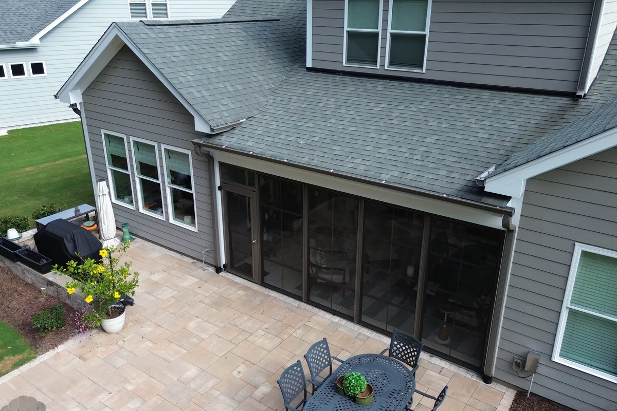 Finished porch enclosure perimeter wall view showing Earthstone aluminum color on Belmont NC home