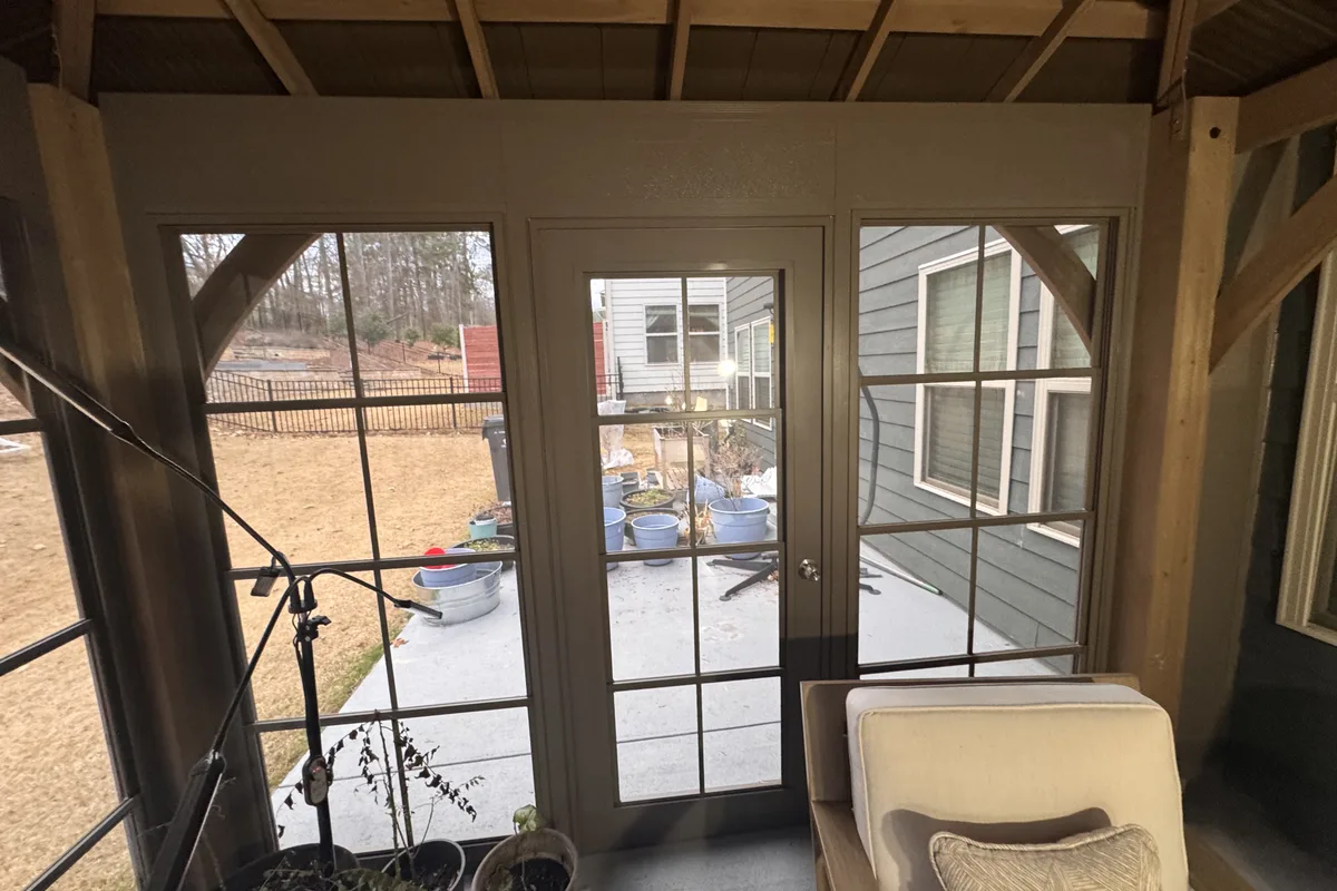 Corner post connection detail on Craft-Bilt aluminum wall system at Clems Branch Charlotte NC prefab pergola enclosure showing secure attachment