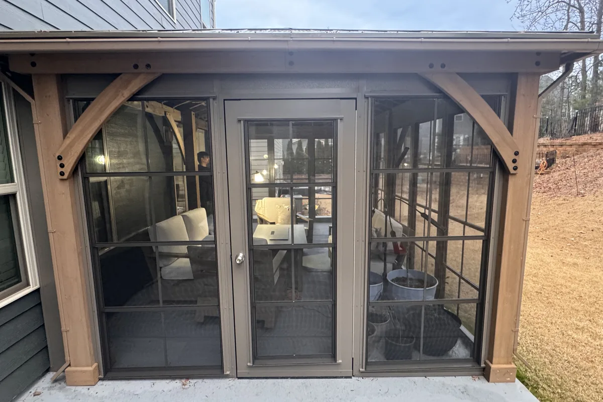 Close up of vinyl film panel locking track detail on Clems Branch Charlotte NC 3-season enclosure showing built-in screen and secure closure system