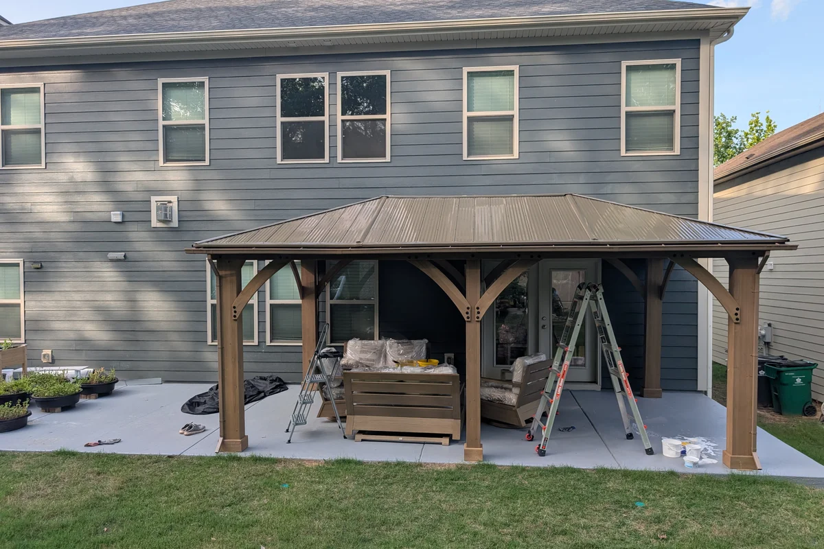 Open prefab hardtop pergola in Clems Branch Charlotte NC before 3-season vinyl film enclosure installation with no side panels or weather protection