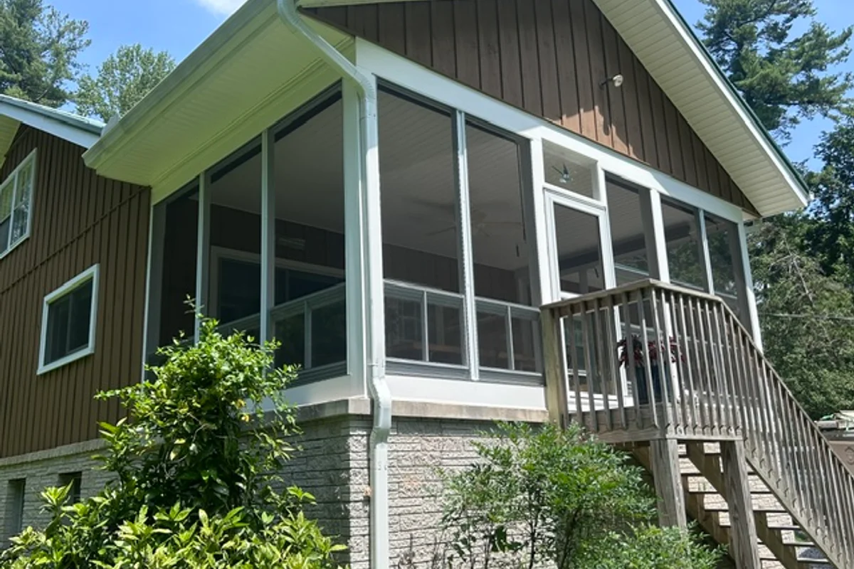 Finished vinyl film 3-season sunroom exterior Flat Rock North Carolina