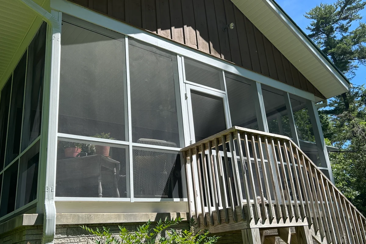 Completed 3-season vinyl film porch enclosure exterior in Flat Rock NC