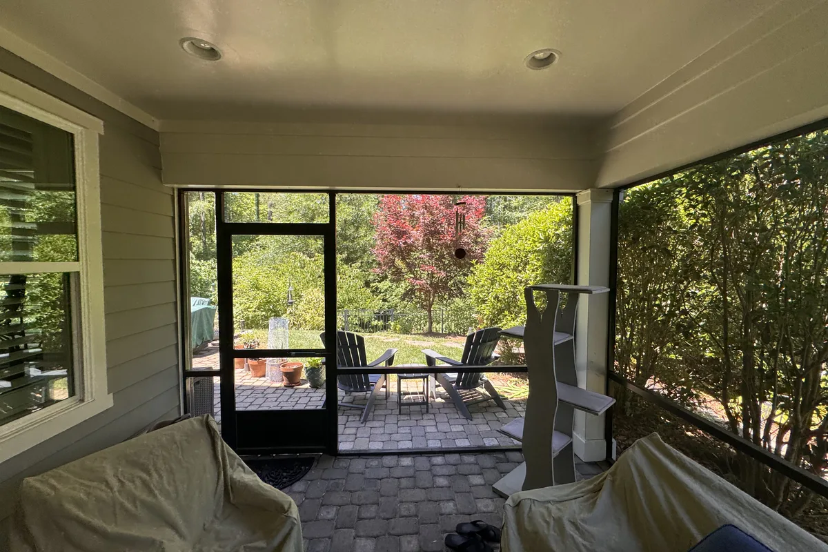 Pre-installation view of screened porch enclosure in Huntersville before vinyl film upgrade