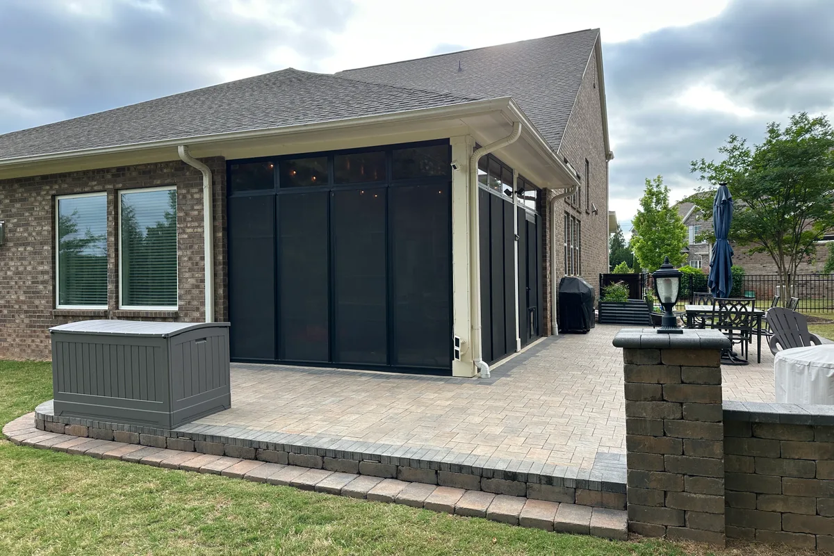 Fixed transom panels above operable vinyl film windows in Livery Stable Matthews NC porch enclosure