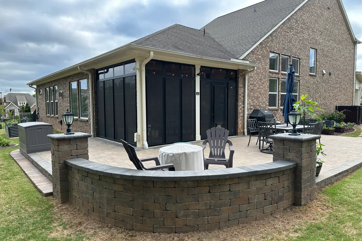 Vinyl film door with integrated pet door insert at Livery Stable Matthews NC porch enclosure project