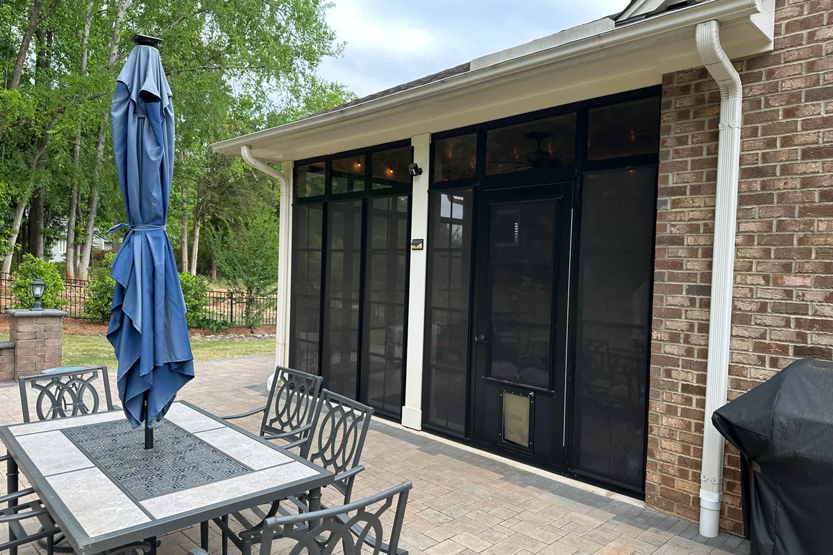 Interior view of completed Livery Stable vinyl film 3-season porch enclosure showing clean dust-free surfaces during pollen season