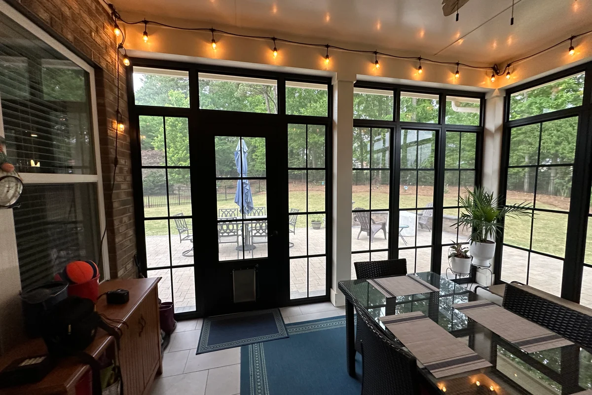 Completed 3-season vinyl film enclosure replacing aluminum screened porch in Livery Stable Matthews NC