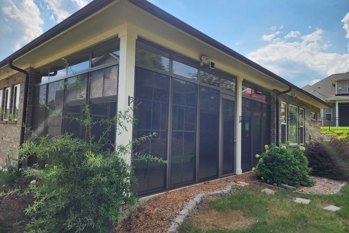 Finished 3-season vinyl film porch enclosure exterior view Matthews NC