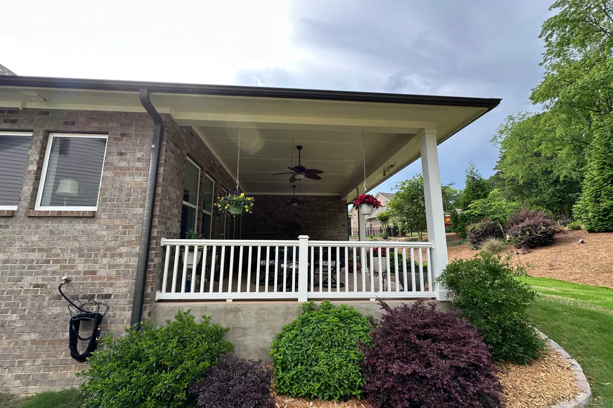 Open-air patio before vinyl film sunroom conversion in Matthews NC
