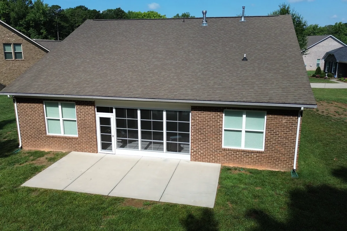 After: finished vinyl-film enclosure detail of 3-season sunroom in Mint Hill, Mecklenburg County
