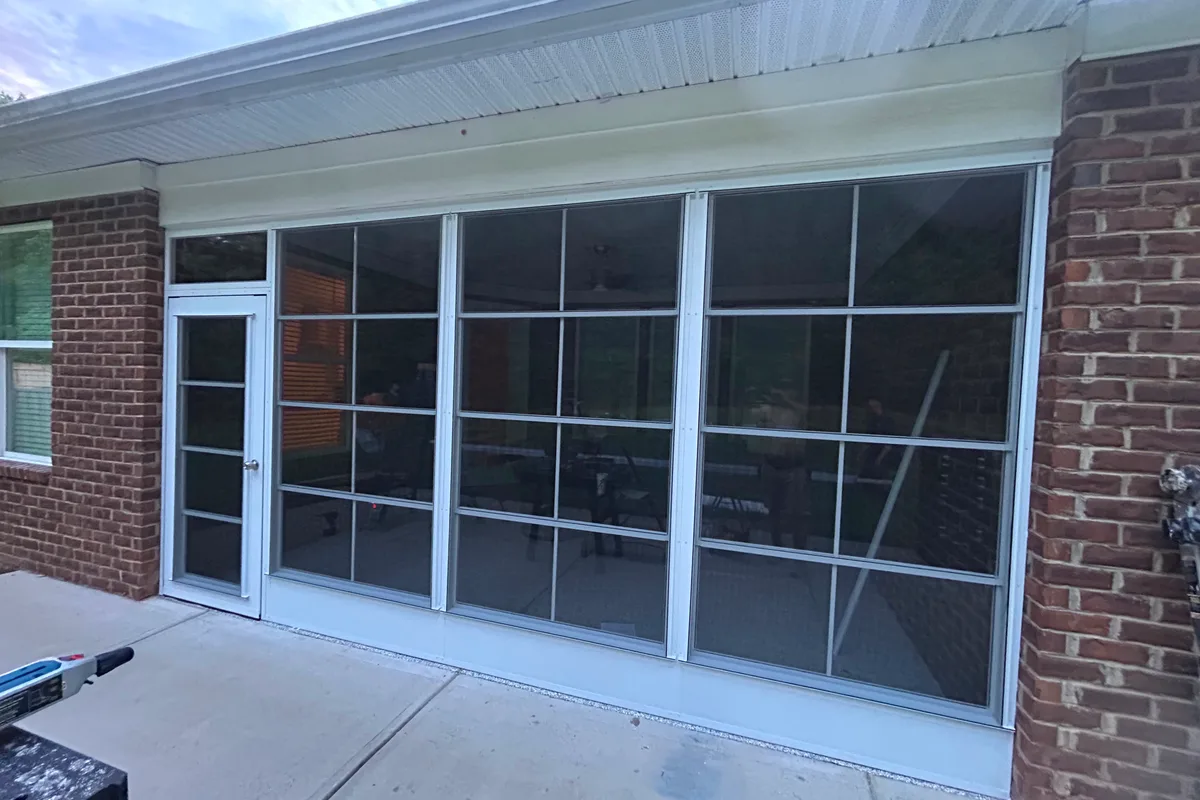 After: final detail of professional vinyl-film porch enclosure contractor work in Mint Hill, NC
