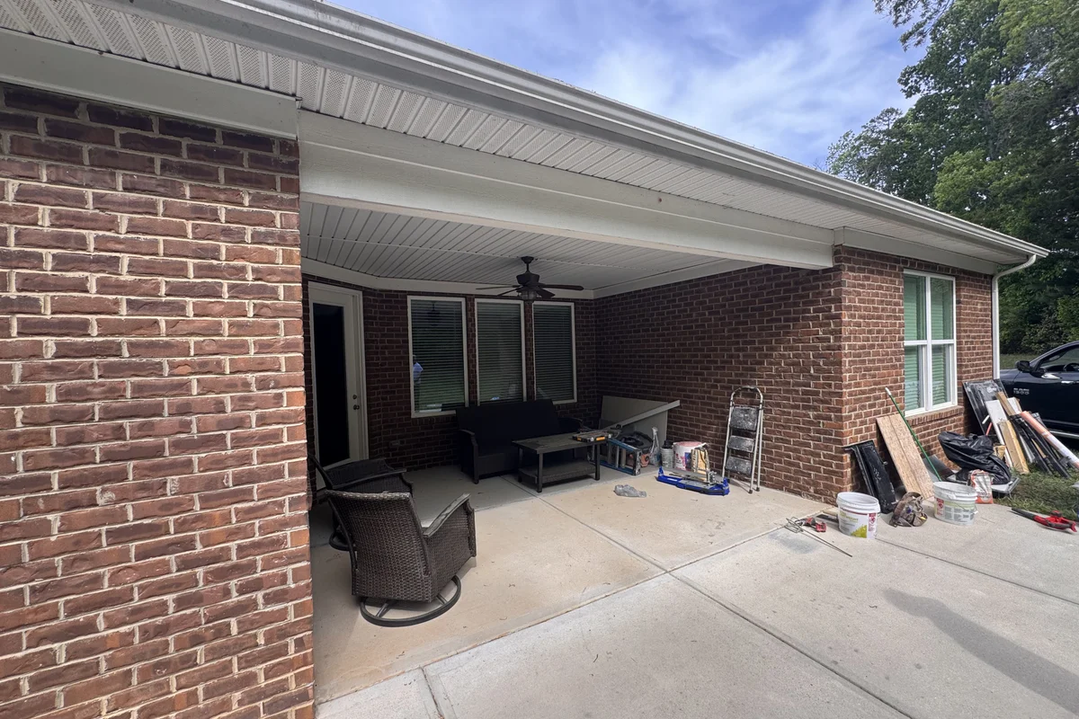 Before: exterior view of porch ready for 3-season vinyl-film enclosure in Mullis Forest, Mint Hill NC