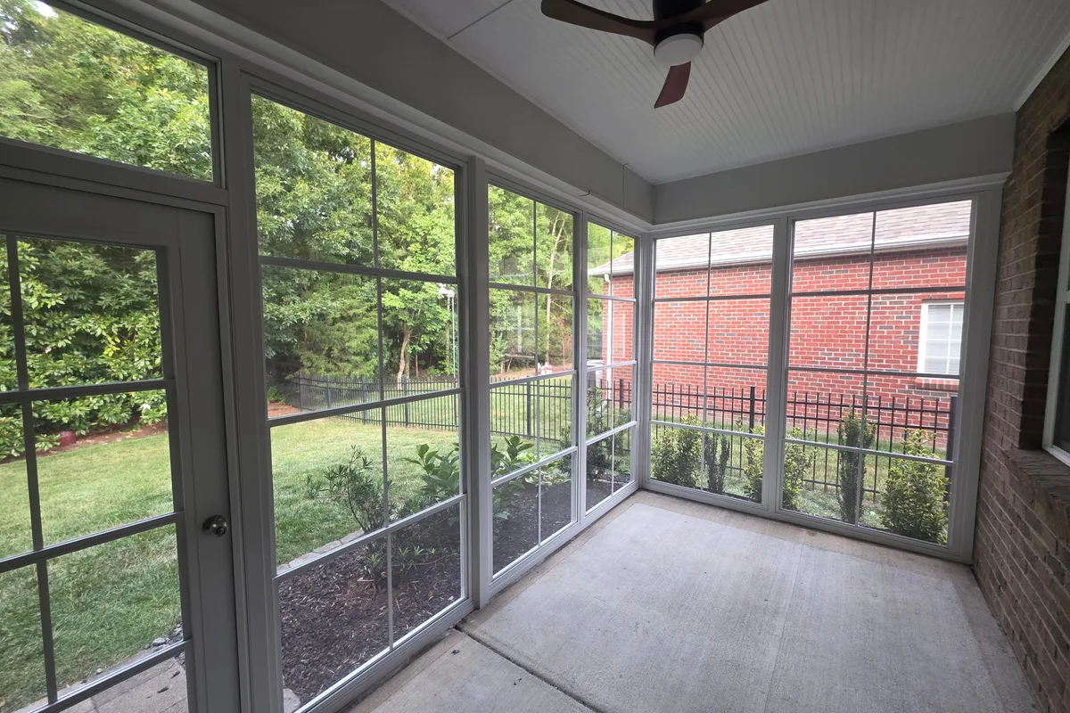 Completed vinyl film porch enclosure detail Weddington NC contractor