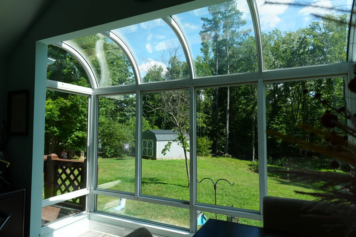 Enclosed sunroom detail showing quality 4-season construction Concord NC