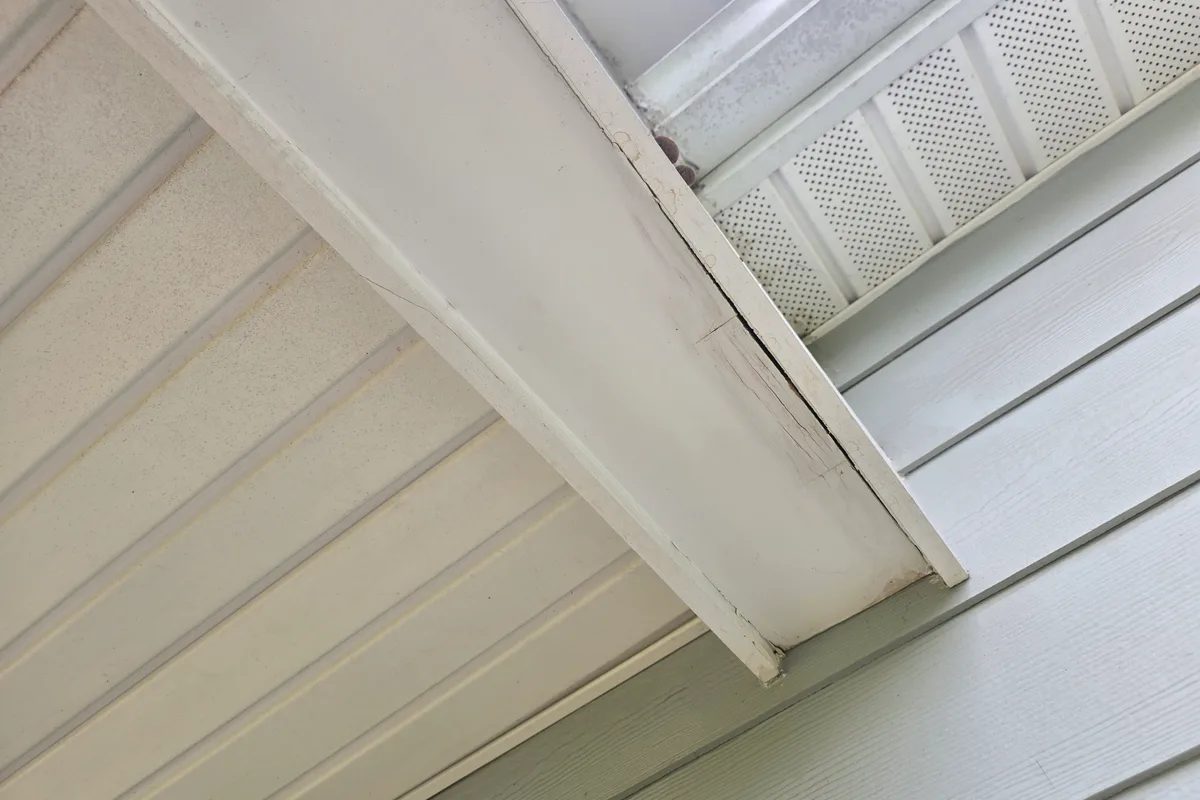 Existing porch structure before roofing contractor work on Ancient Way